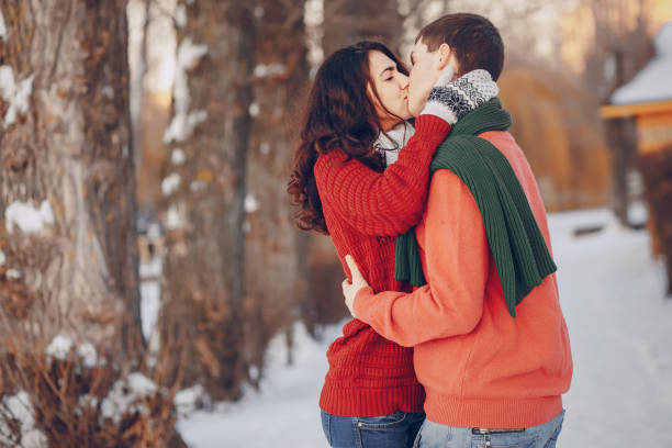 istock beautiful couple having fun in the park during winder 857648932