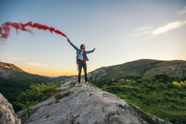 istock Young man on top of the mountain 857649436