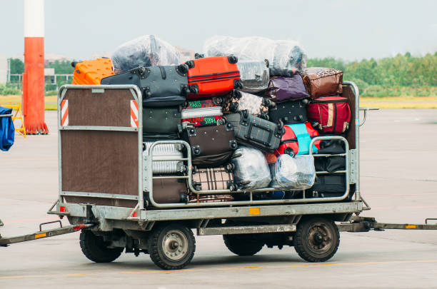 istock Airport luggage Trolley with suitcases before loading into the aircraft. 857653806