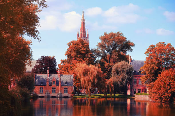 Autumn day in Brugge. Trees with red foliage in famous destination of Belgium in Brugge.