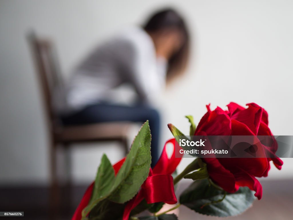 Sad Woman Sitting And Crying With Red Rose In Focus Lonly Love ...