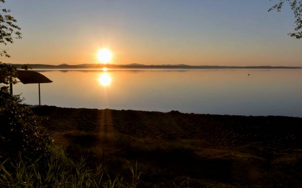 istock Golden sun sinks over the lake in the evening 857674346