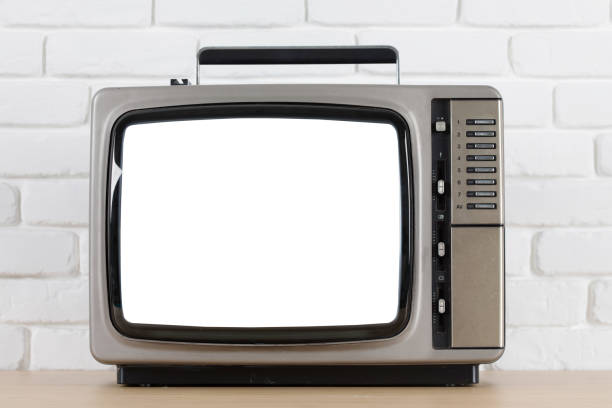 istock Old television with cut out screen on a white brick wall background. 857681302