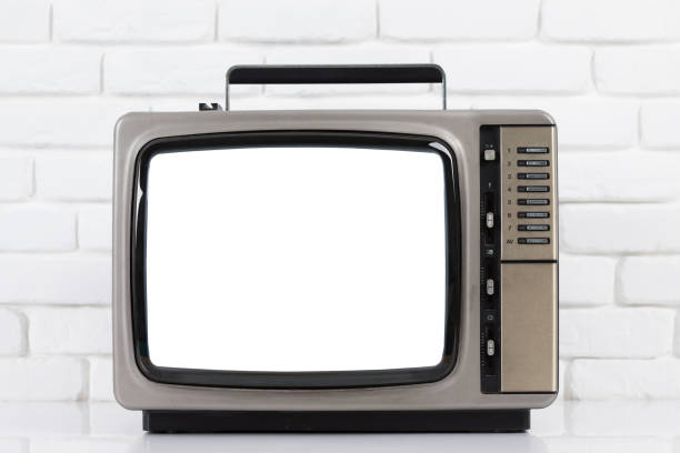 istock Old television with cut out screen on a white brick wall background. 857681322