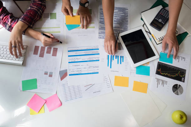 istock Business team adviser analysis financial data on paper denoting the progress in the work,consult concept and top view. 857689096