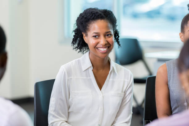 istock Confident woman attends support group meeting 857689154