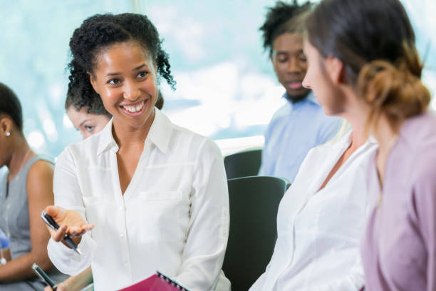 istock Businesspeople discuss something during seminar 857689180