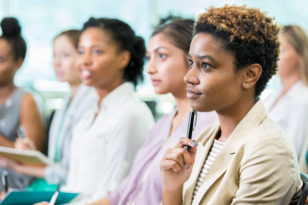 istock Thoughtful woman attends business conference 857689206