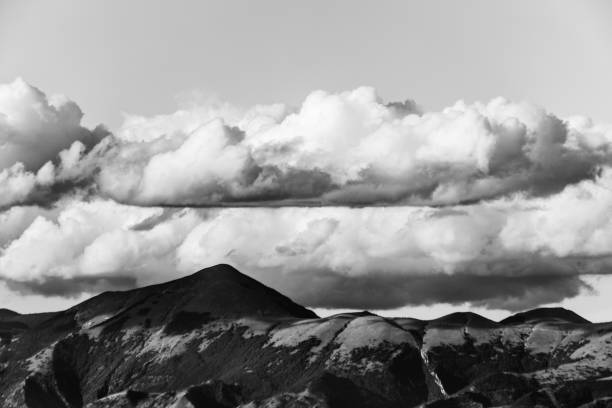 istock A view of some mountains top with some big, close clouds above them 857696656