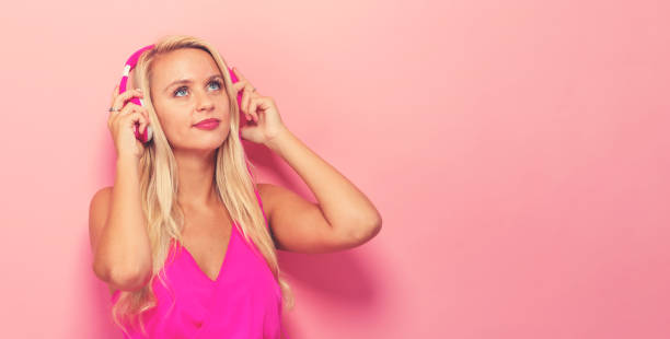 istock Happy young woman with headphones 857701632