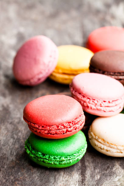 istock colorful  macarons on rustic wooden backrgound 857712044