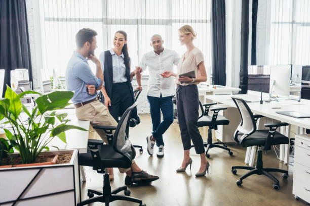 istock business colleagues talking in office 857715326