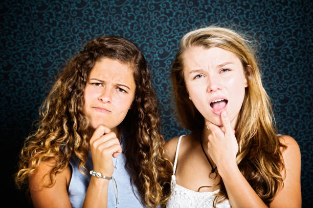 istock Two beautiful girls are puzzled 857715474