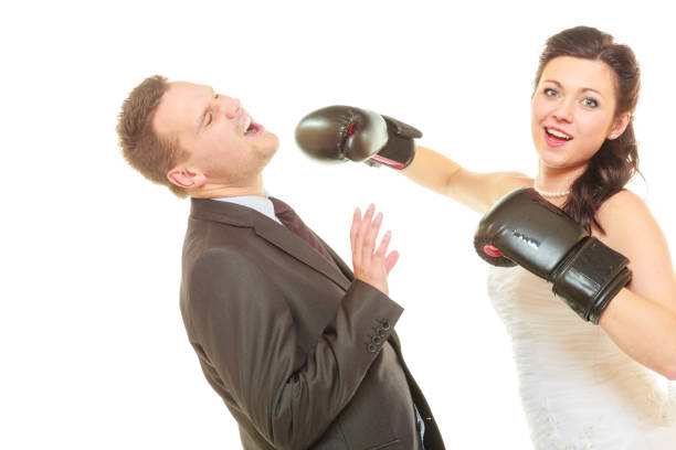 istock Bride boxing her groom on wedding 857716698