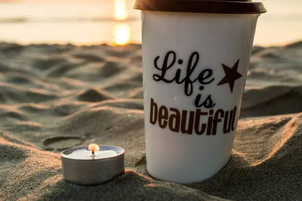 Photo of Cup of coffee on sunrise