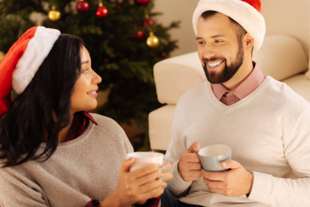 istock Happy couple drinking coffee together on Christmas Eve 857730162