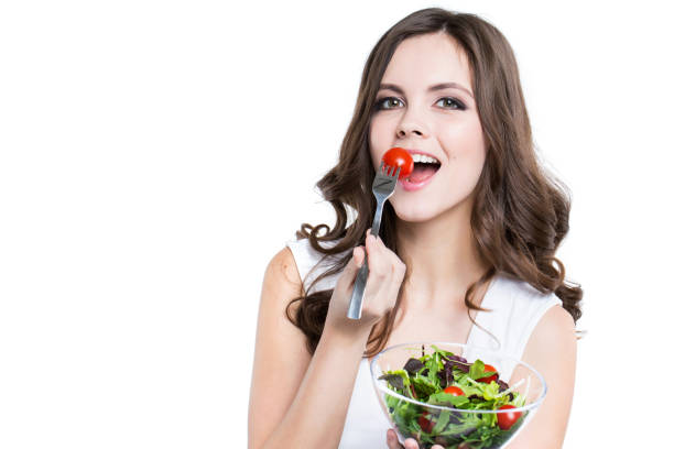 istock Beautiful smiling woman with salad isolated. 857731838