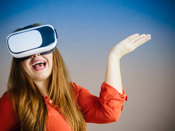 istock Girl wearing virtual reality goggles. 857732370