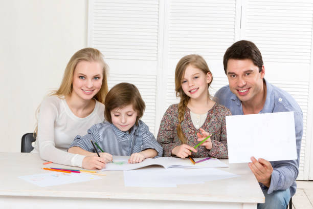 istock Happy family with colored pencils and laugh. 857733144