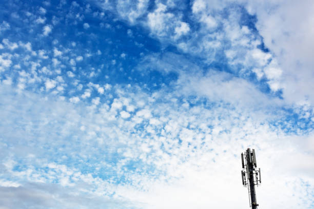istock Mobile phone repeater tower against lightly clouded skly 857736150