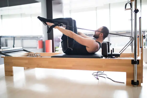 Photo of Male Exercising At Fitness Center