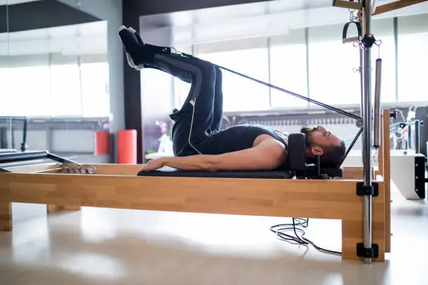 Photo of Male Exercising At Fitness Center