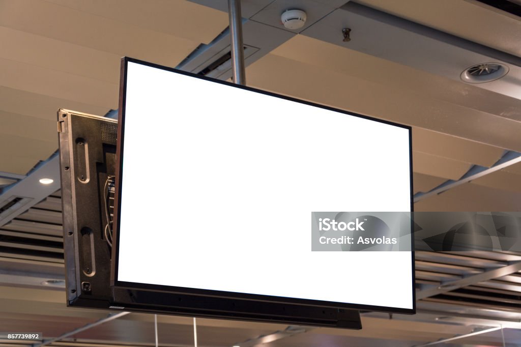 Blank ad space screen hanging from the ceiling close up Television Set Stock Photo