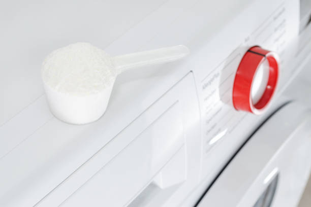 istock washing powder over washing machine 857742544