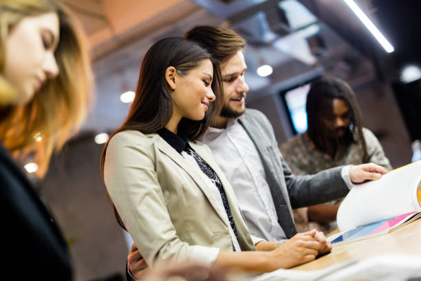 istock Group of well dressed people in a pub 857743378