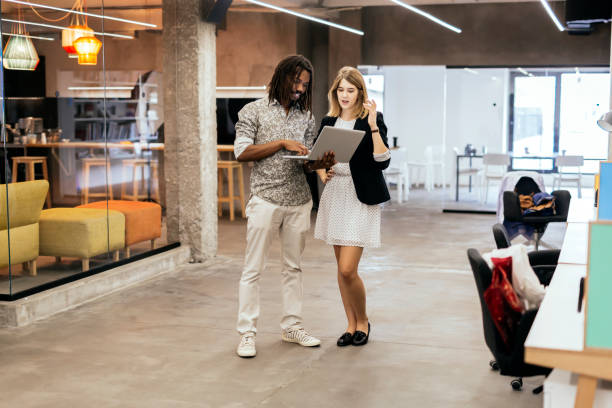 istock Coworkers talking in a modern office 857743556