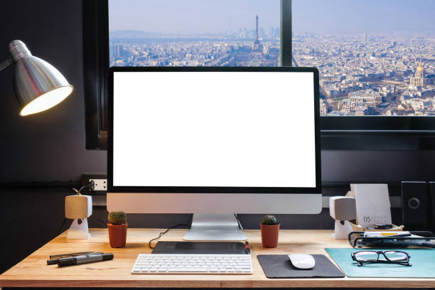 istock Graphic designer's workspace equipped with a pen tablet, a computer and white backgroud for text with beautiful Paris view city from the window 857751498