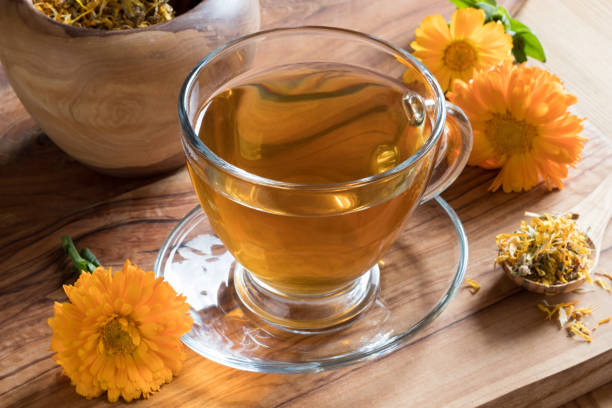 istock Calendula tea and calendula flowers 857755808