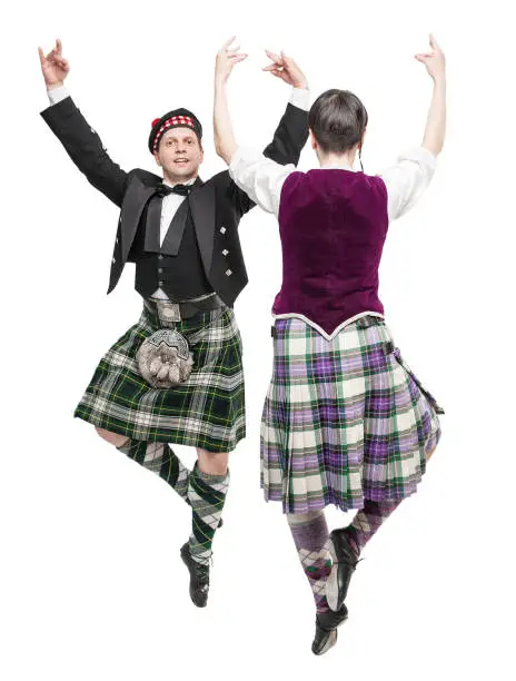 The pair woman and man dancing Scottish dance isolated