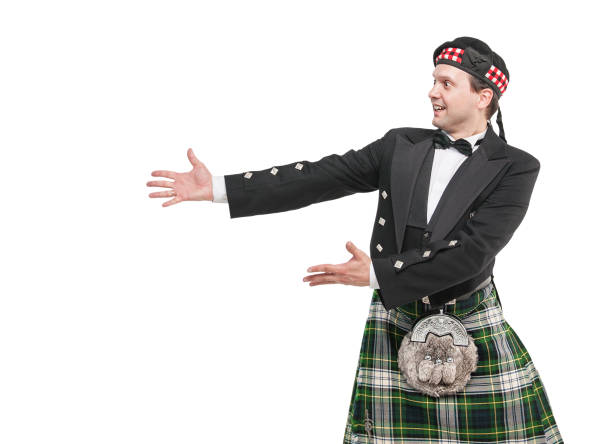istock Handsome man in traditional Scottish costume pointing on something 857762016