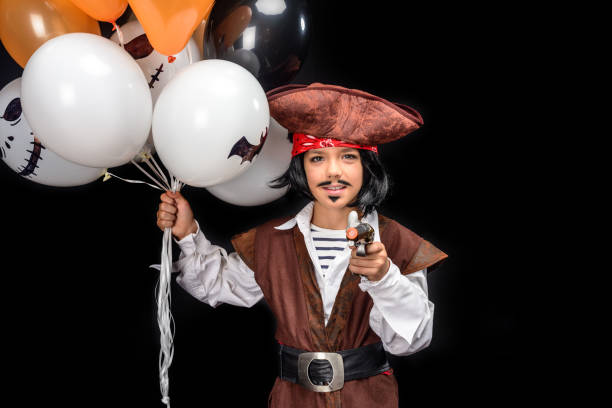 istock little pirate with gun and balloons 857766150