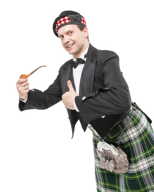 istock Scottish man in traditional national costume with smoking pipe 857766218