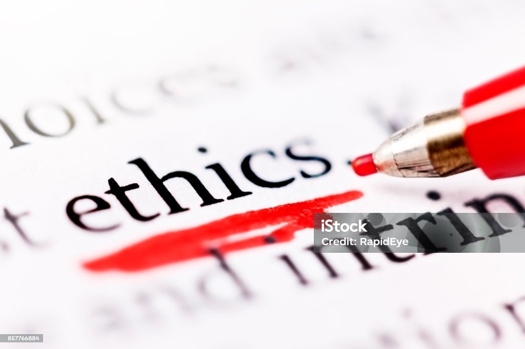 Felt-tip pen underlines word "ethics" in document A red felt-tipped pen underscores the word "ethics" on a printed page. Morality Stock Photo