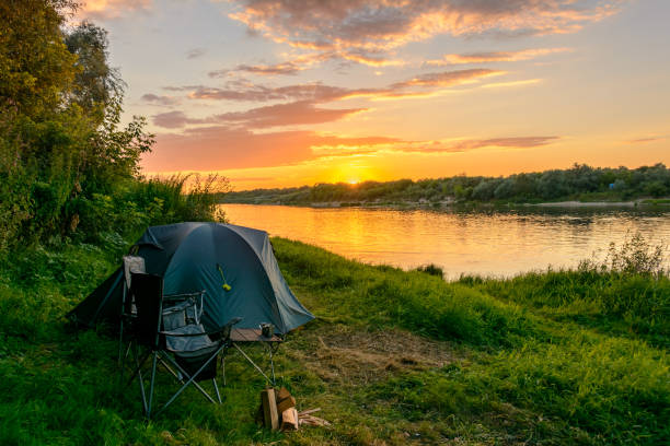 istock Camping and tent in the woods by the river 857767096