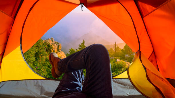 istock Hikers relaxing in camp tent 857767516