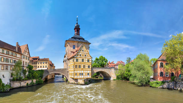 Panorama of Old Town Hall of Bamberg, Germany Bamberg. Panoramic view of Old Town Hall of Bamberg (Altes Rathaus) with two bridges over the Regnitz river, Bavaria, Germany bamberg photos stock pictures, royalty-free photos & images