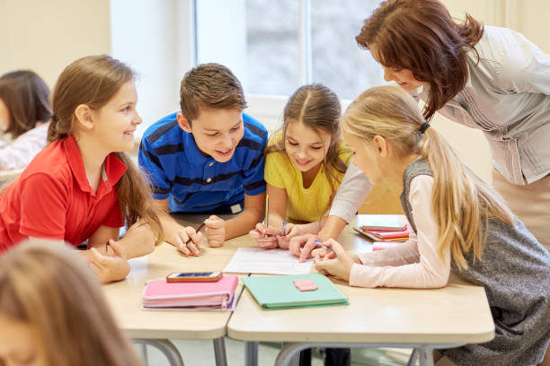 istock group of school kids writing test in classroom 857768898