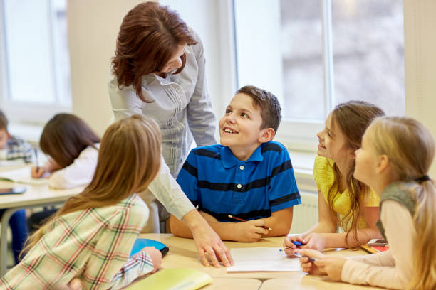istock group of school kids writing test in classroom 857774148