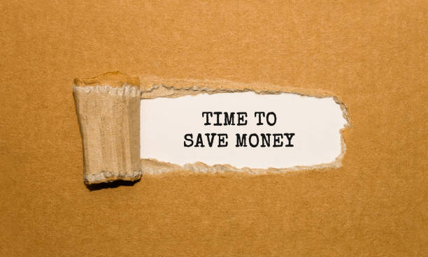 istock The text TIME TO SAVE MONEY appearing behind torn brown paper 857777524