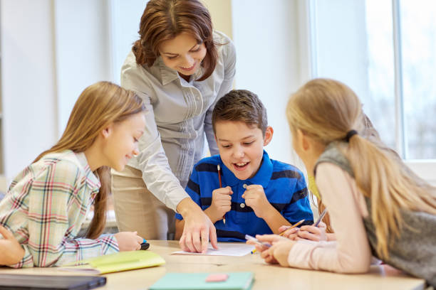 istock group of school kids writing test in classroom 857777606