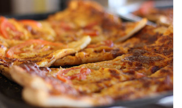 istock Sliced mixed pizza on the metal tray 857777728