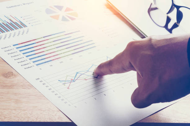 istock close- up businessman hand poing at turnover graph 857781786