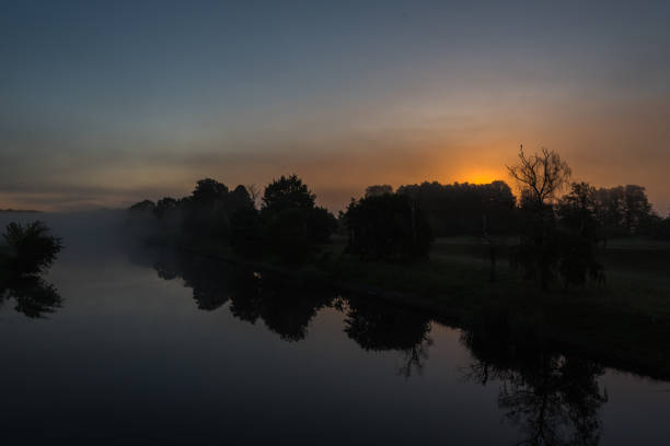 istock campercar and Sunrise in the swamp 857782708