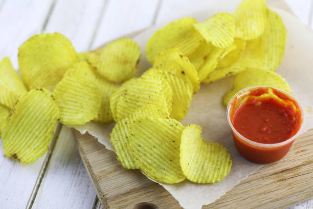 istock Potato chips on a wooden tray 857786506