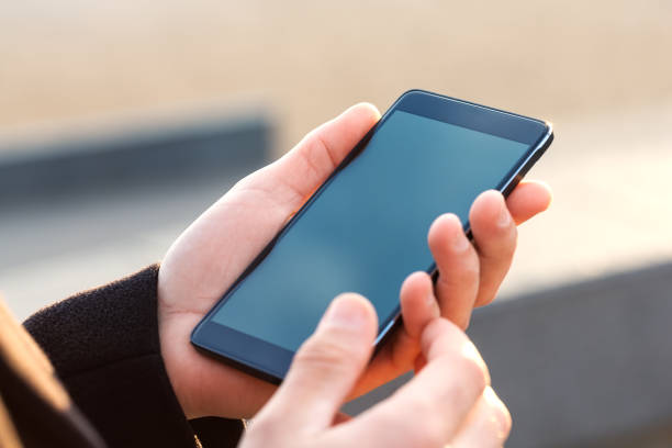 istock Businessman using his Mobile Phone outdoor 857790412