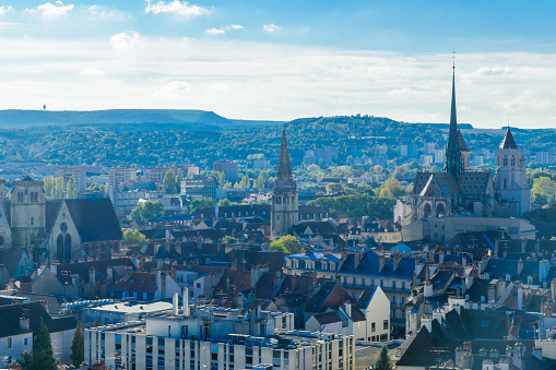 Aerial panoramic view across the rooftops and spires of central Copenhagen at sunset, Denmark.